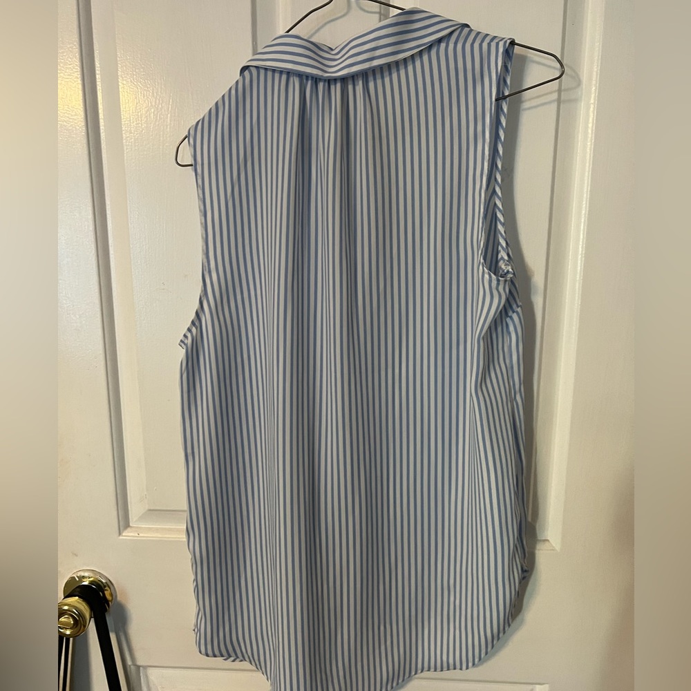 I am selling a striped light blue and white sleeveless blouse.